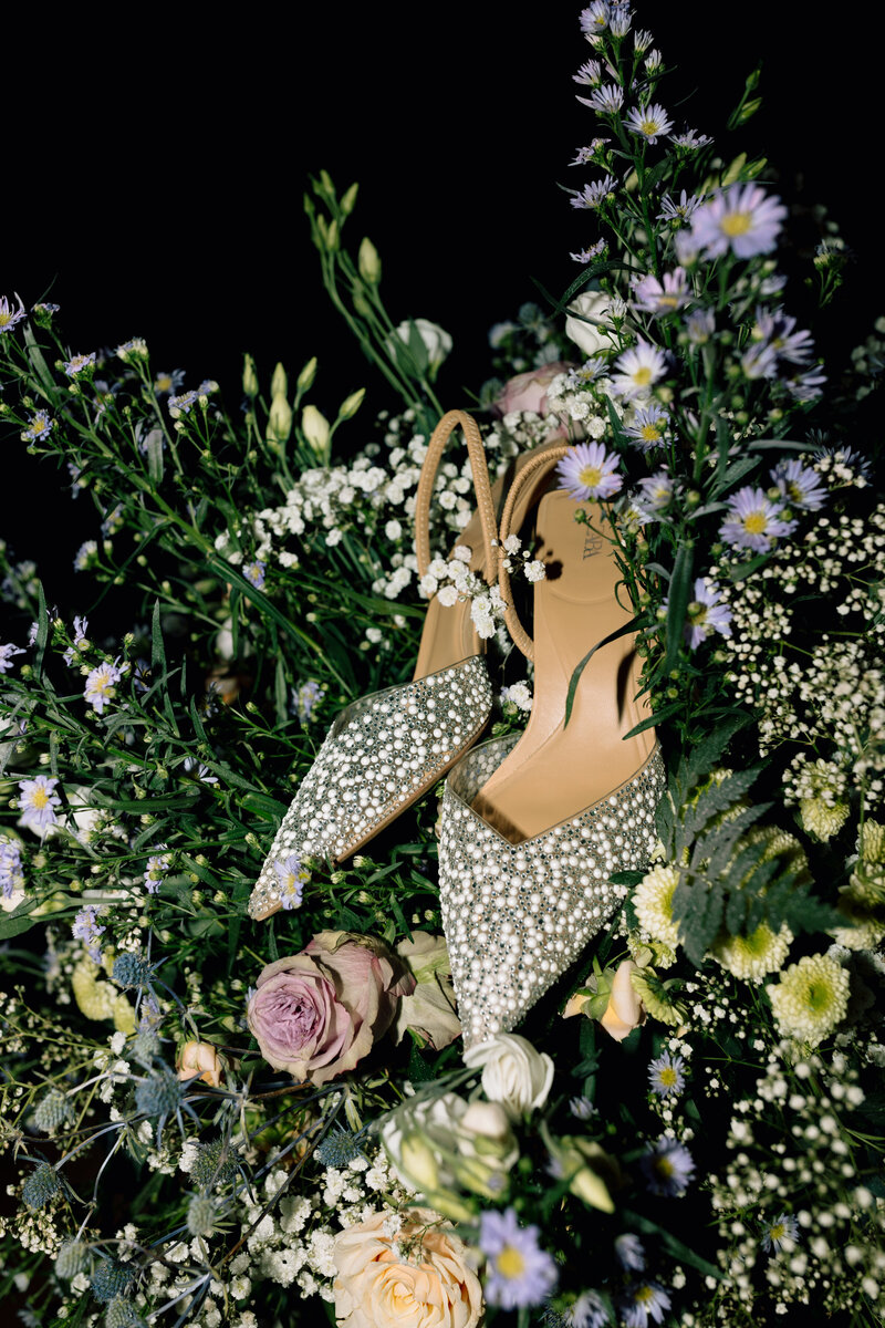Wedding Shoes Sitting in Bouquet
