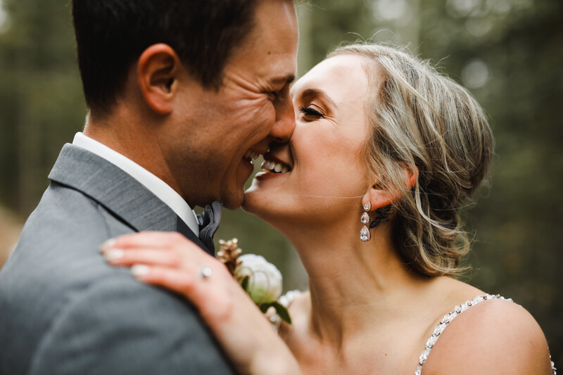 Candid moment of laughter captured by Calgary wedding photographer