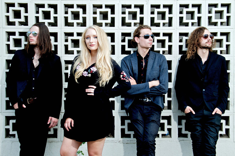 Nashville Country Music Group Portrait Juliana Hale And BAnd Of Roses standing in front of wall of patterned concrete blocks