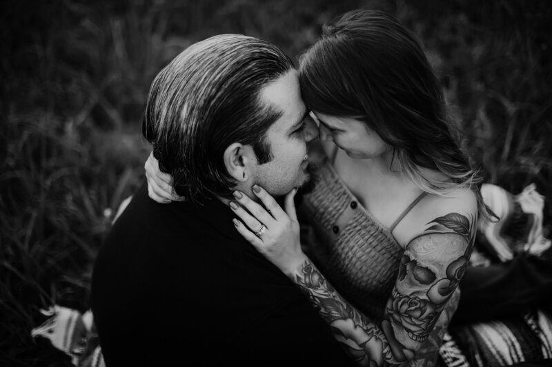 Black and white couple session of two people holding each other close