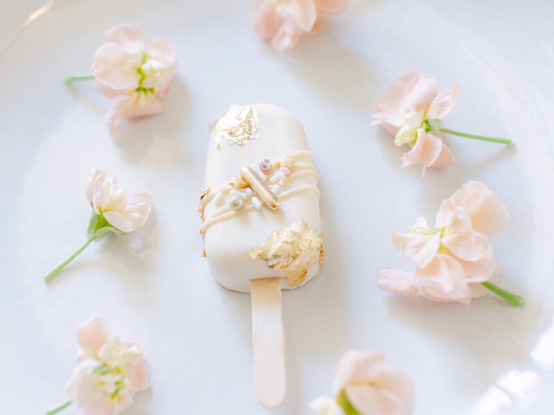 Decadent popsicle adorned with vibrant floral elements