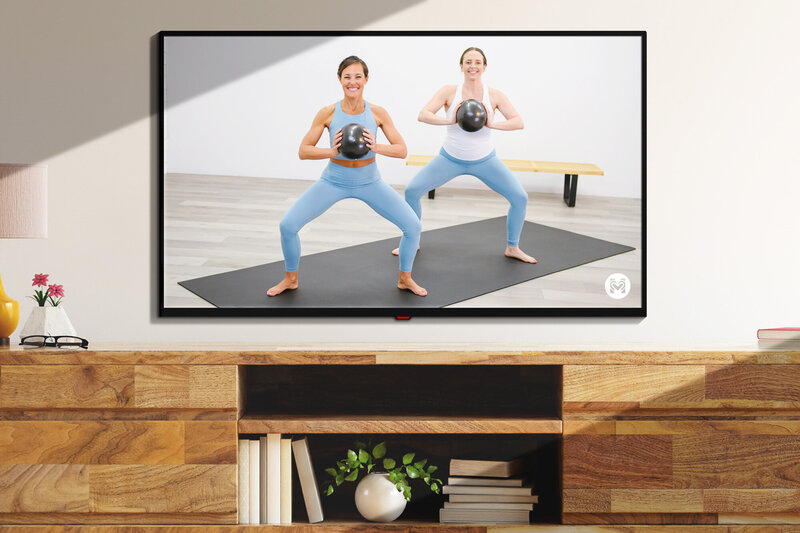 TV screen with Moms Into Fitness video