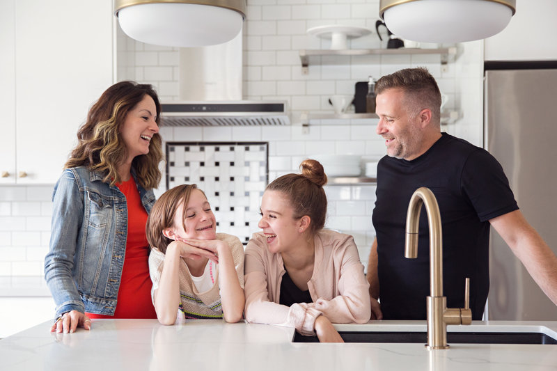 lifestyle family in white kitchen