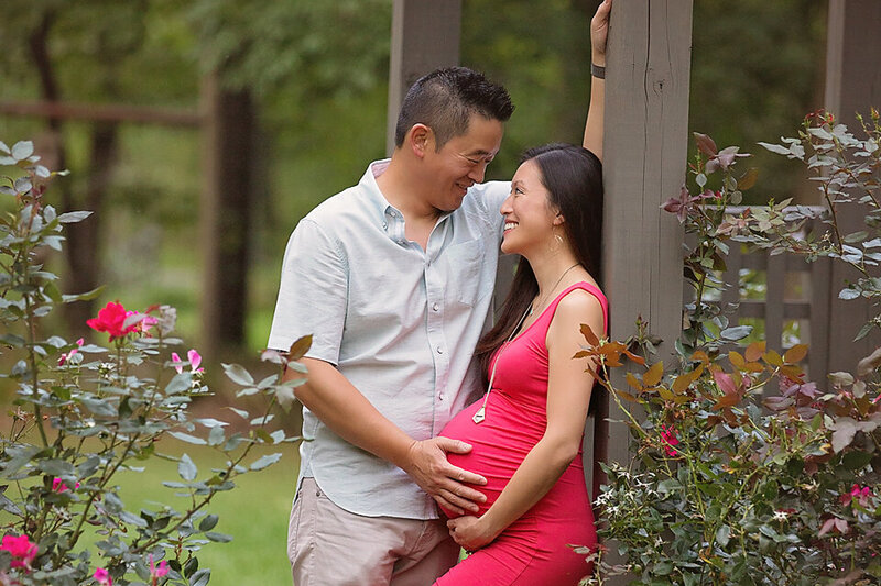 nj maternity couple posing for their pregnancy portraits in a local park