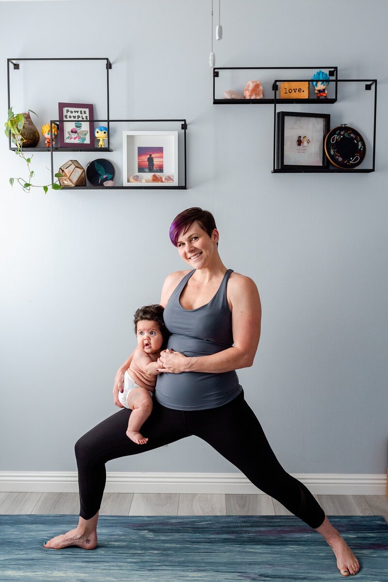 empowering photo of Culver City yoga instructor holding baby on her hip