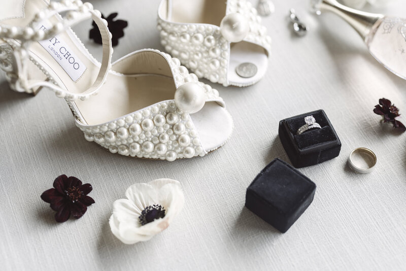 timeless black and white wedding details including Jimmy Choo wedding shoes with pearls by Benfield Photography shot at Big Cedar Lodge at Top of the Rock wedding