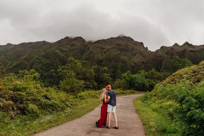 photo of Allie and Tyler in front of a mountain in Hawaii