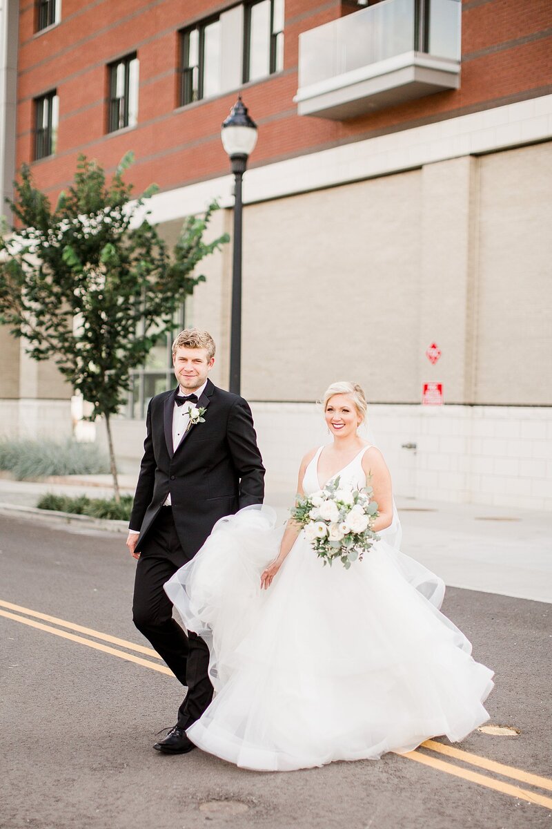 walking across the street by Knoxville Wedding Photographer, Amanda May Photos