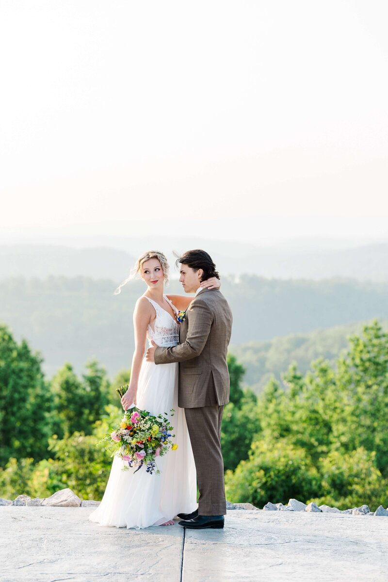 Bride and groom overlooking mountains by Knoxville Wedding Photographer Amanda May Photos
