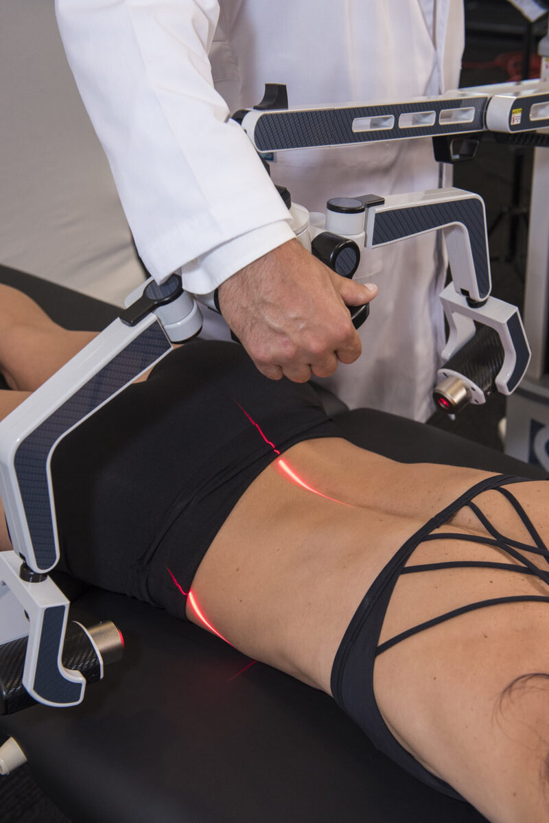 cold laser therapy applied to a womans low back