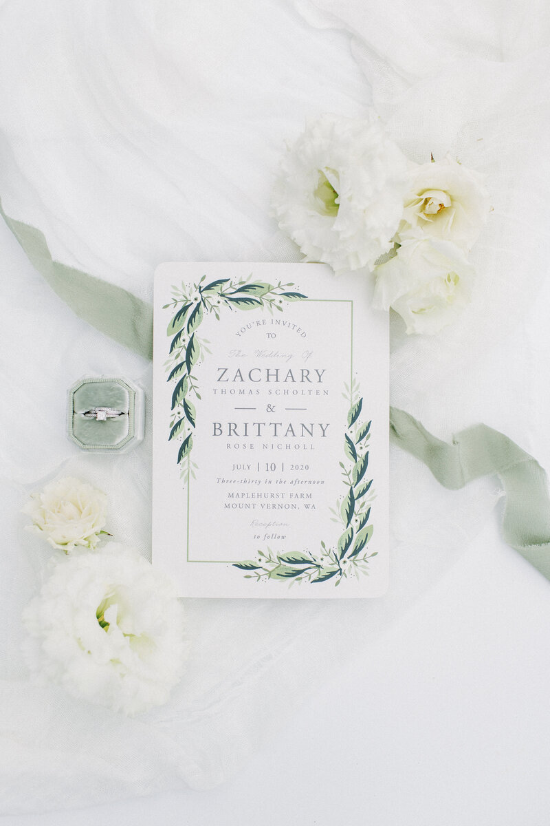 wedding invitation in white and sage green