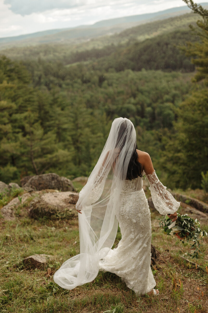 Brides wedding dress portrait atop mountain at Le Belvedere in Wakefield Quebec