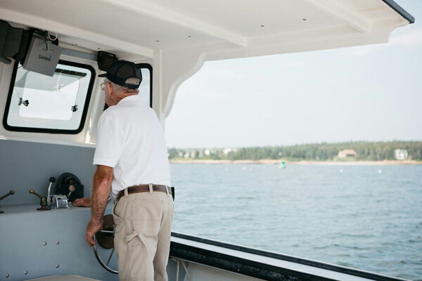 man driving a boat