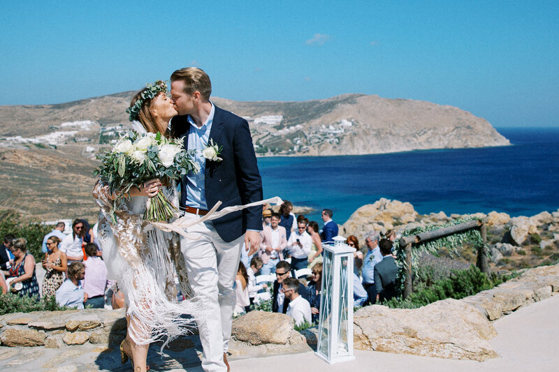 Bride & Groom kiss after getting married in Mykonos