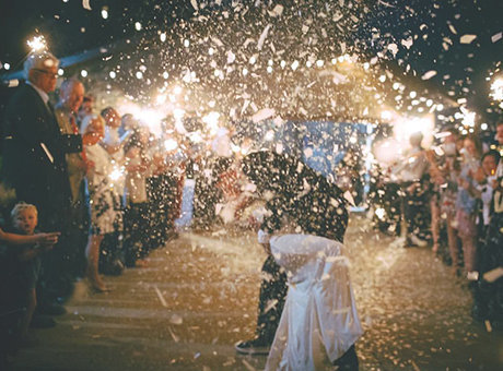 Wedding reception getaway sparklers and confetti