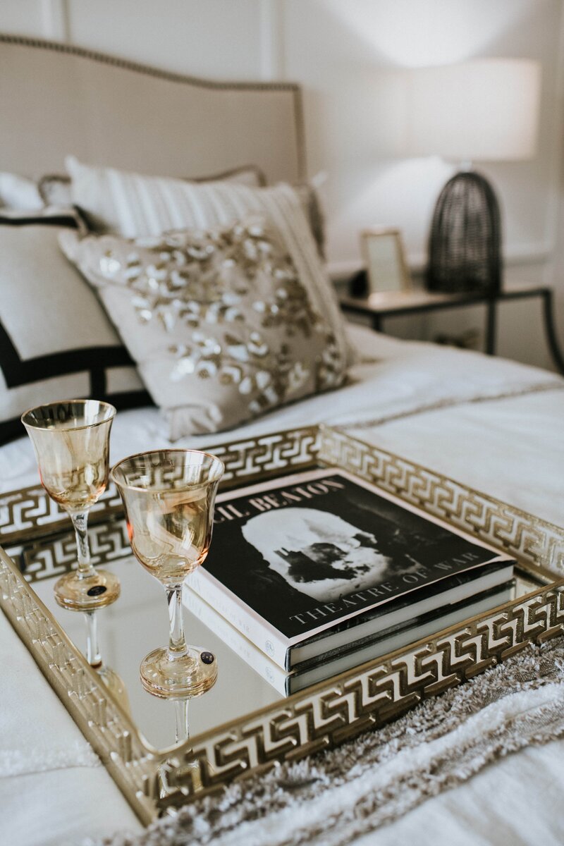 Wine glasses on a bed