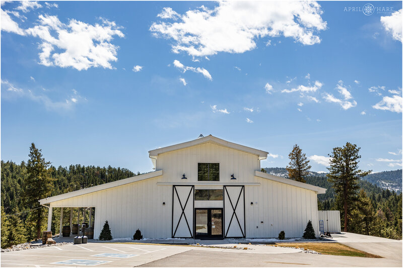 Modern White Barn Wedding Venue near Denver Colorado on a bright sunny spring day in April