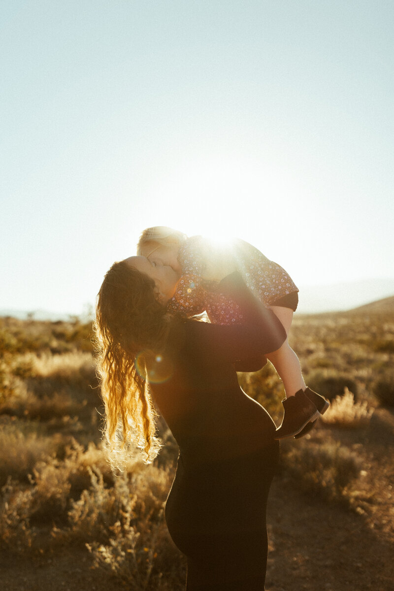 a couple kissing in the windy mountain landscape