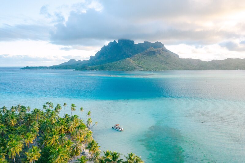 Drone Photography view on the Mount Otemanu in Bora Bora and the blue lagoon - boat trip