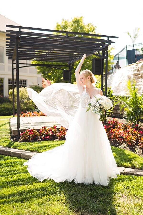 dancing-bride-reacts-to-wind-blowing-veil-ohio-wedding small gallery