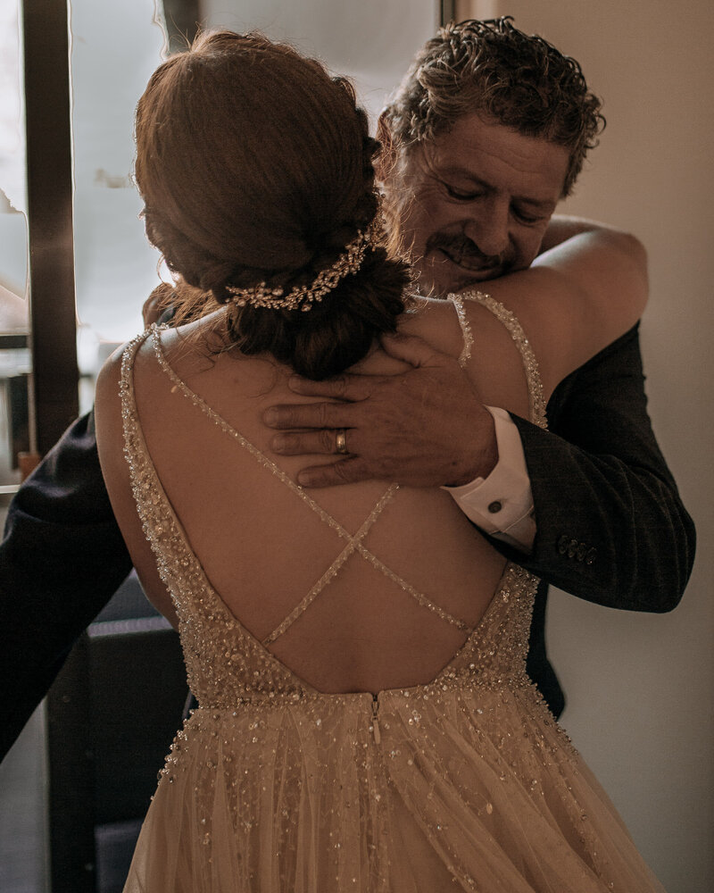 bride hugging her dad on their wedding day