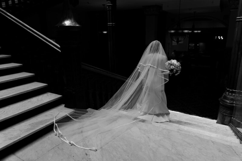 Bride descending a grand staircase
