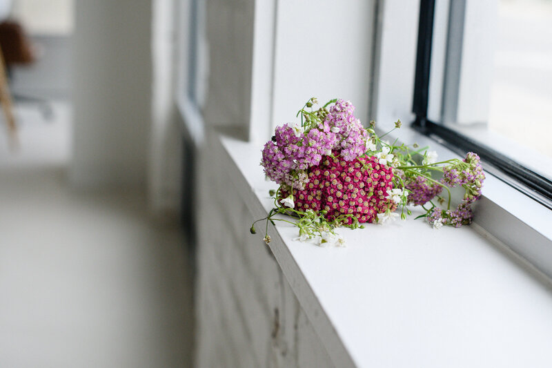 denver brand photographers captures florals sitting on a window sill captured by branding photos