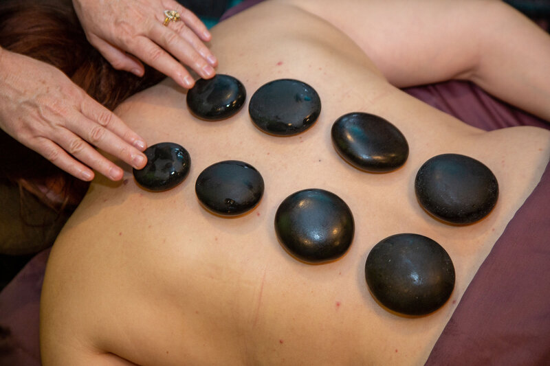 Hot stone therapy on back