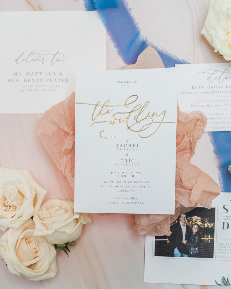 invitation suite with blue and pink details