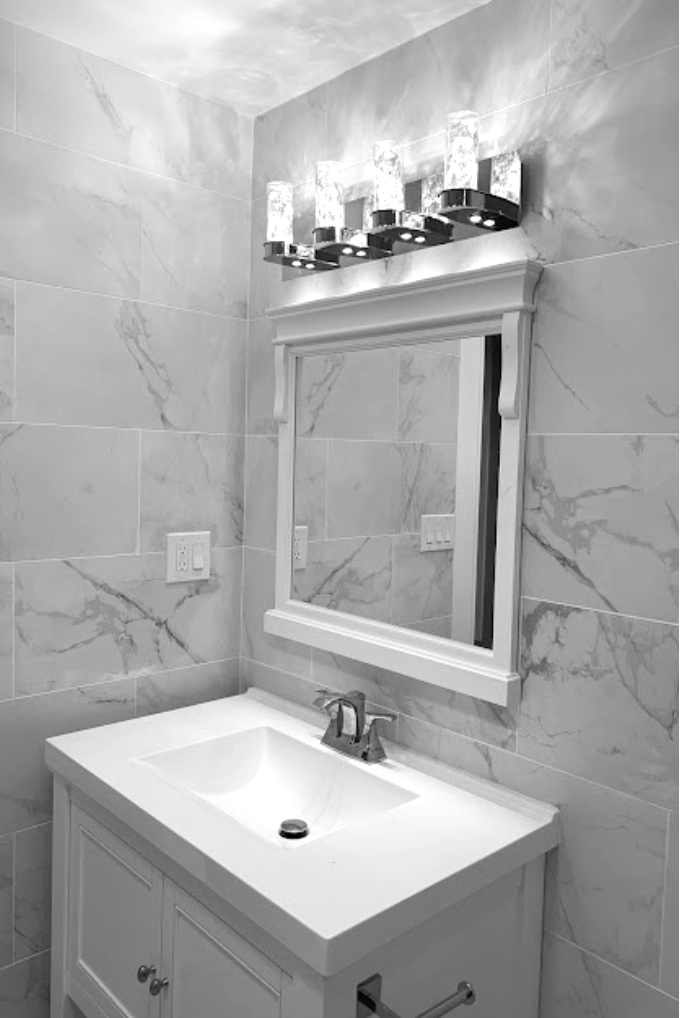 Beach style bathroom renovation in jersey city, NJ with porcelain tiles