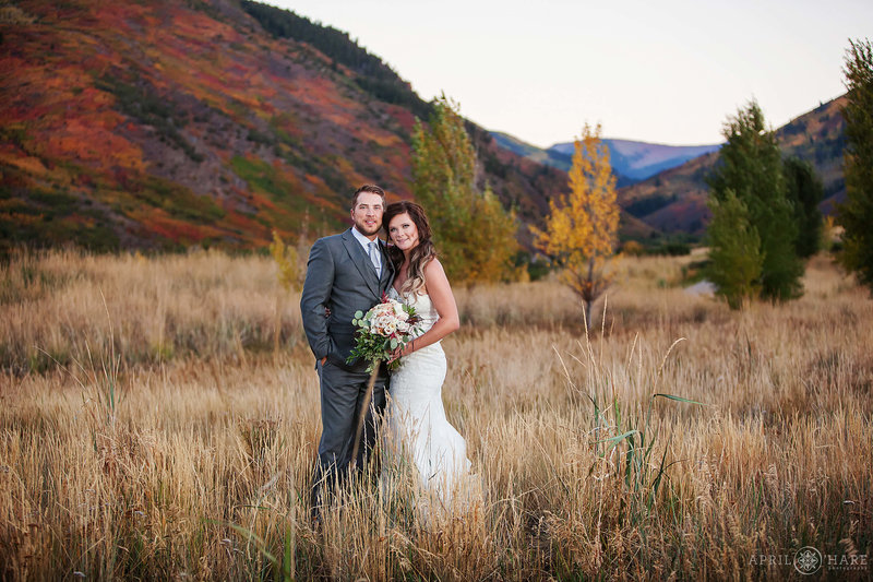 Gorgeous fall color wedding portrait at Frost Creek in Eagle Colorado