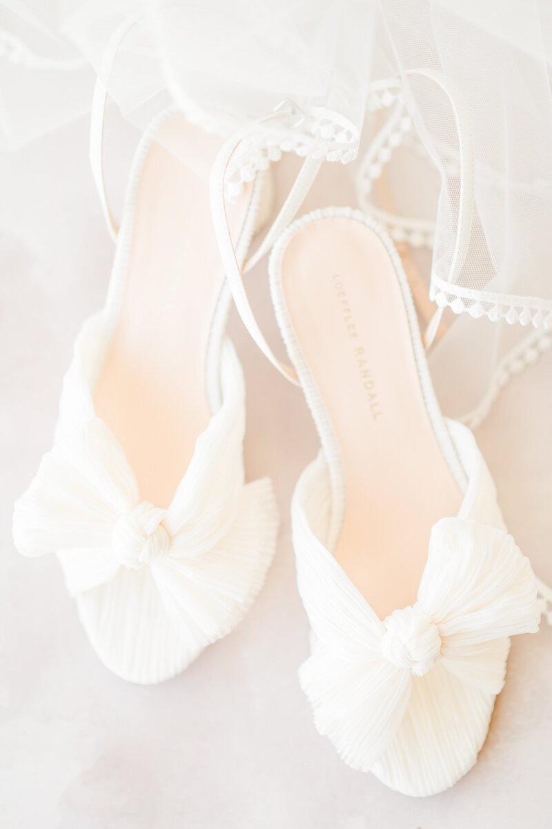 A pair of white Loeffler Randall bridal heels.