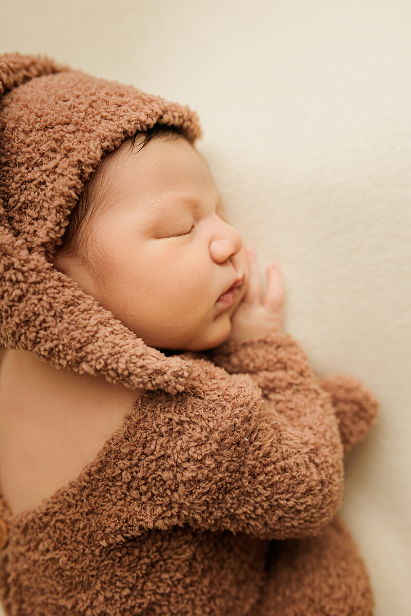 newborn in teddy pajamas emmy medrano photography in vacaville california