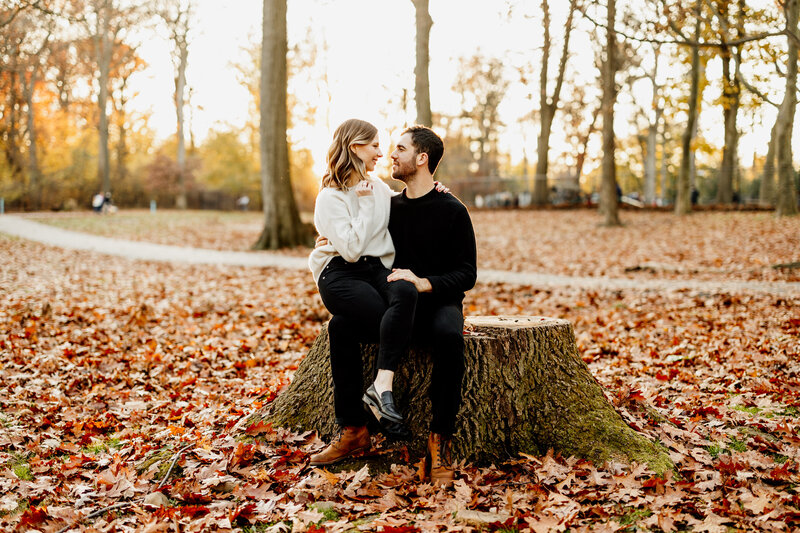engaged couple in woodsy park