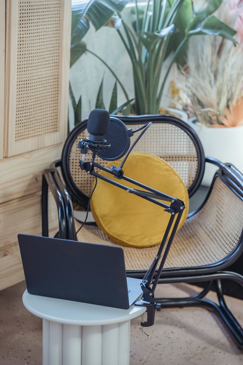 Chair set up by microphone and laptop