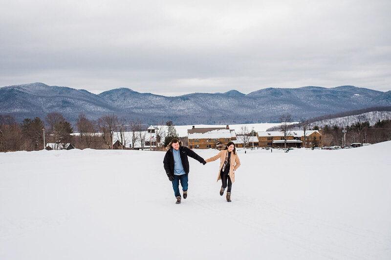 vermont engagement portrait with mountains at mountain top inn winter in chittenden vermont