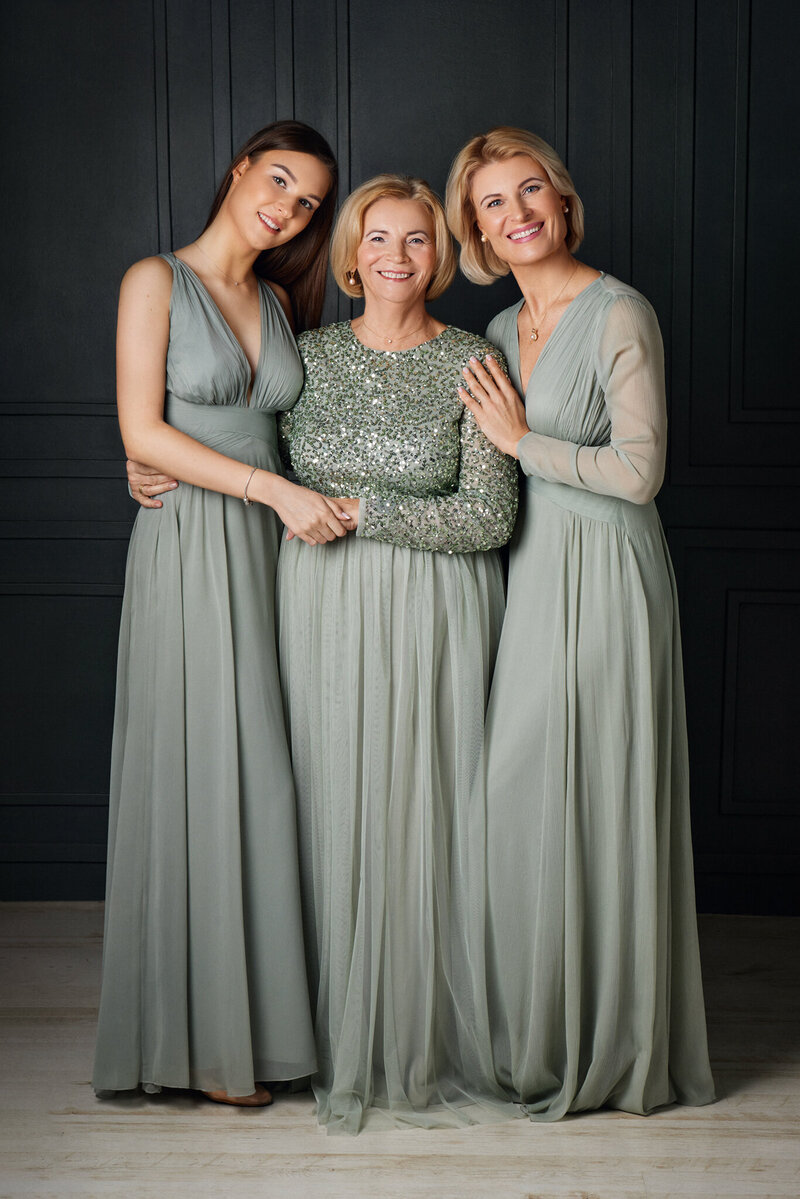 Three beautiful smiling women of three generations portrait in London, Beckenham