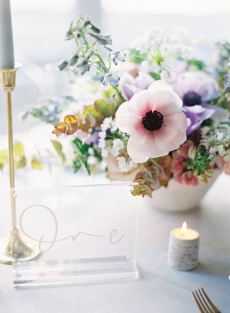 lavendar wedding centerpiece with anemone
