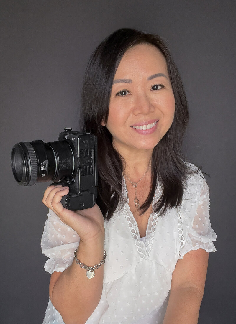 Headshot picture of Oviedo senior photographer Khim Higgins.