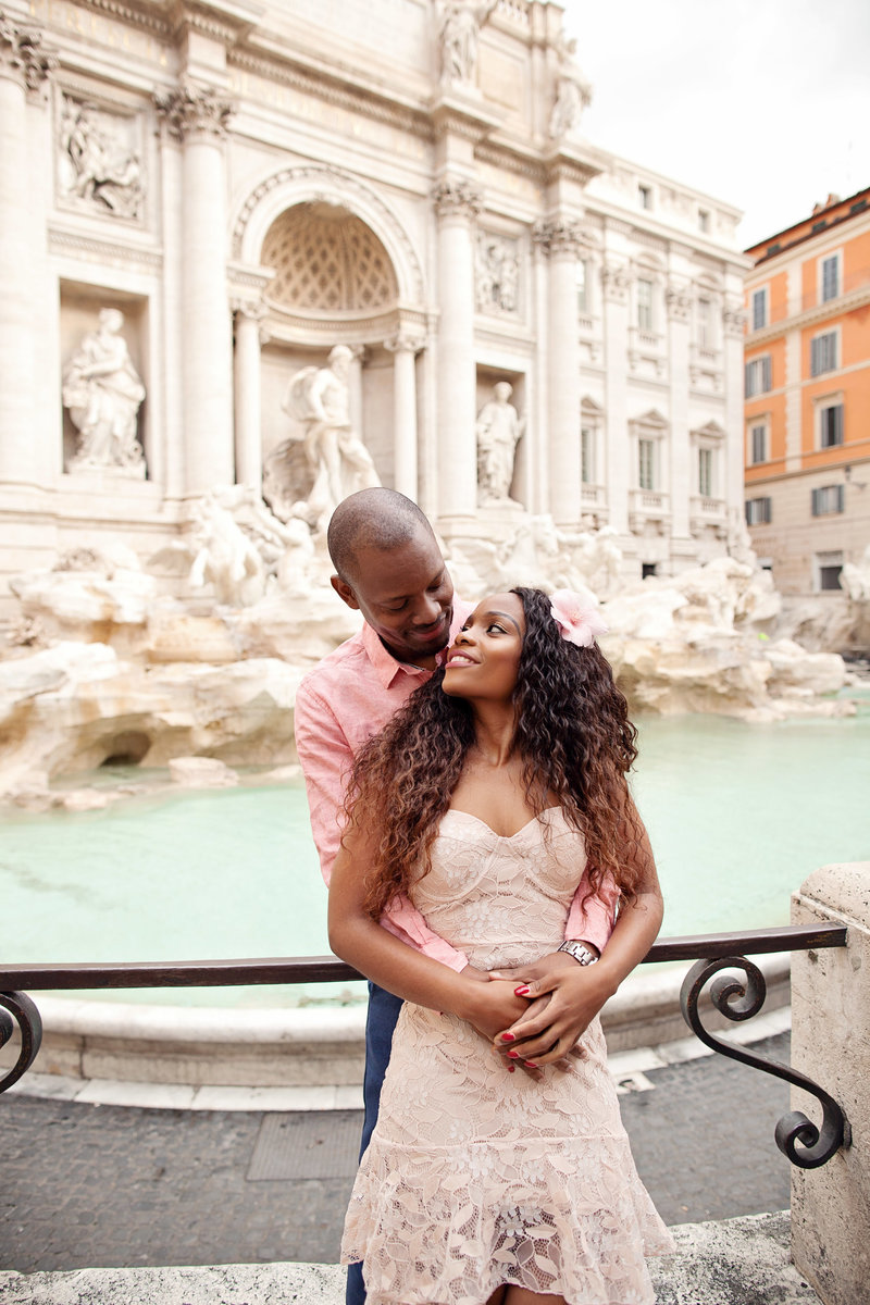 Photo of a couple in front of the Trevi Fountain. Taken by Rome Photographer, Tricia Anne Photography