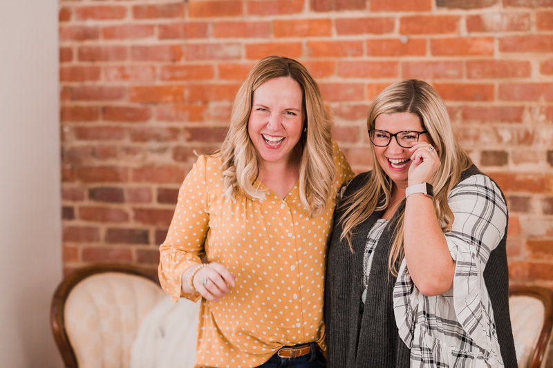 Female entrepreneurs laughing together