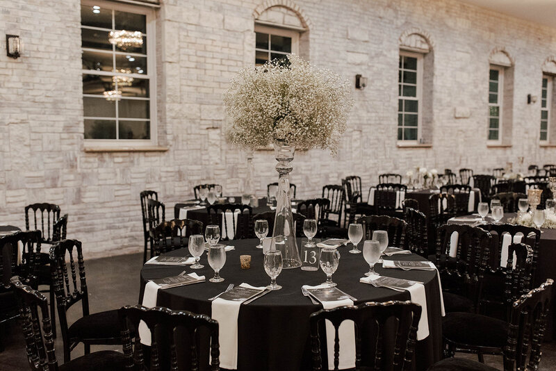 indoor black and white themed wedding reception