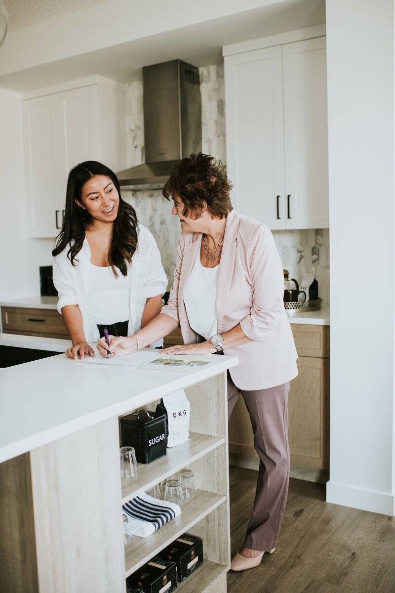 women looking over real estate documents