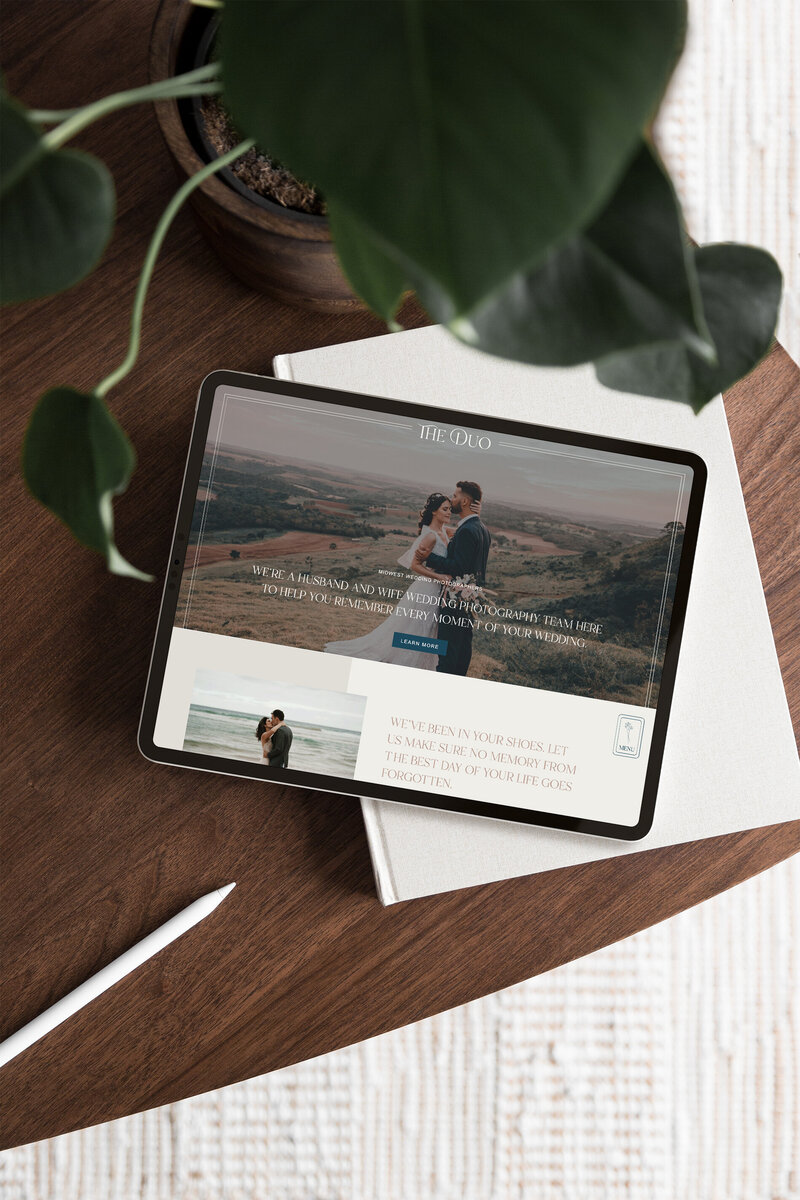 A photography website template shown on an iPad