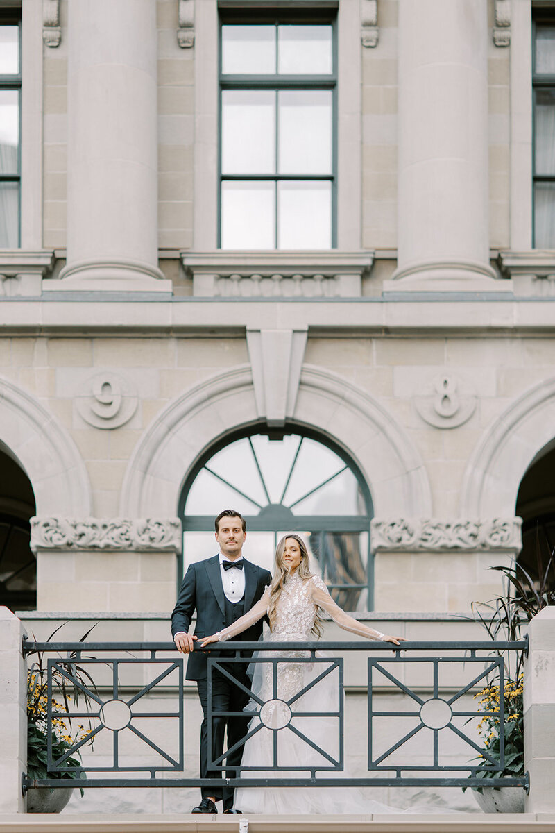 Editorial image of couple in front of architecture in downtown Calgary