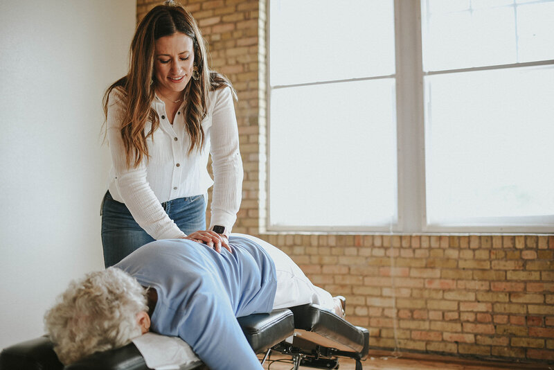 Female Chiropractor doing an adjustment on a male patient