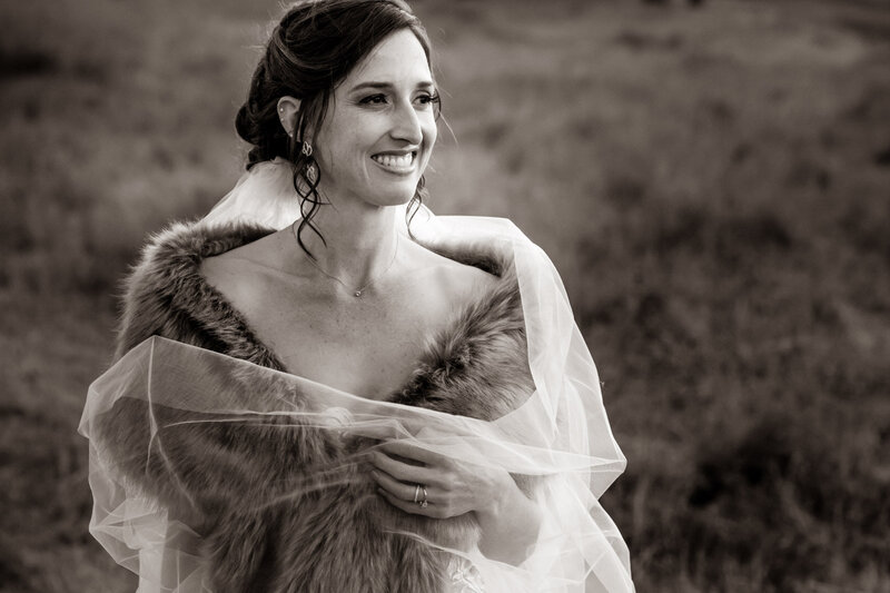 Bride smiling looking through the mountain view