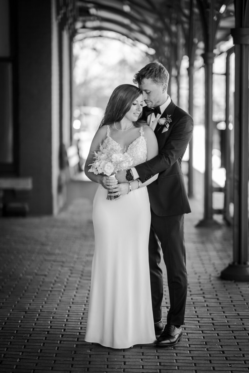 COUPLE PORTRAIT AFTER A WEDDING AT A TRAIN STATION