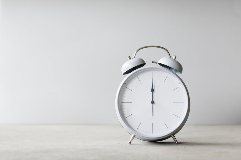 A picture of a clock which is being used as stock image photography for the Dolly DeLong Education Sales Page For The Creative Bookkeeping Template