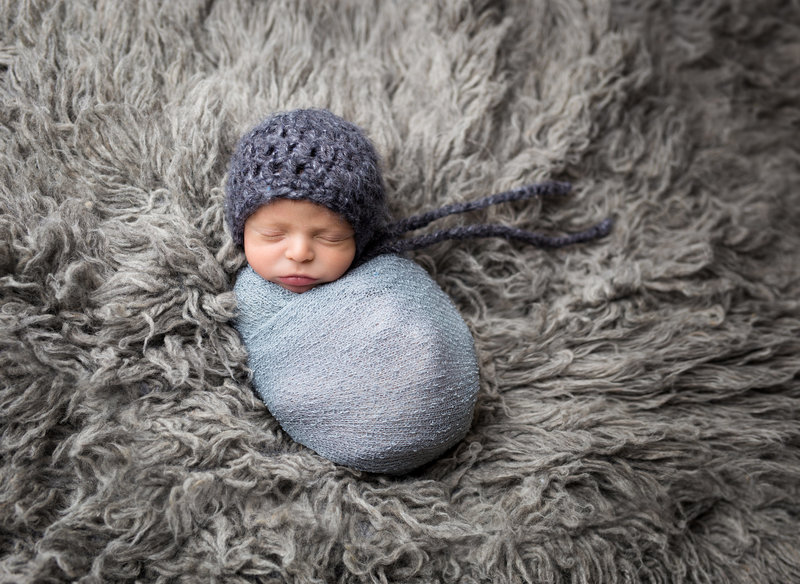 baby wrapped blue and grey flokati